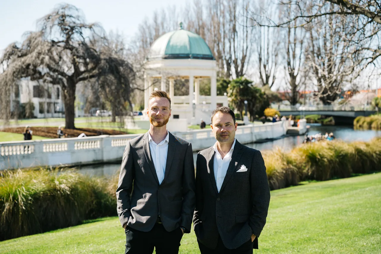 Financial advisers Mitch van der Weert and Jonathan Liong in a Christchurch riverside park